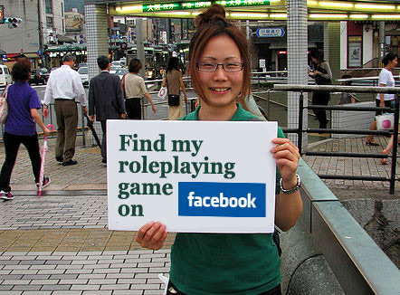 girl holding sign saying "find my roleplaying game on facebook"